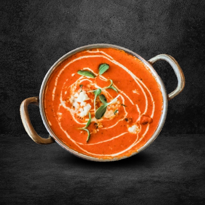 Slow cooked north indian restaurant staple dal makhani served in a traditional kadai rich and creamy