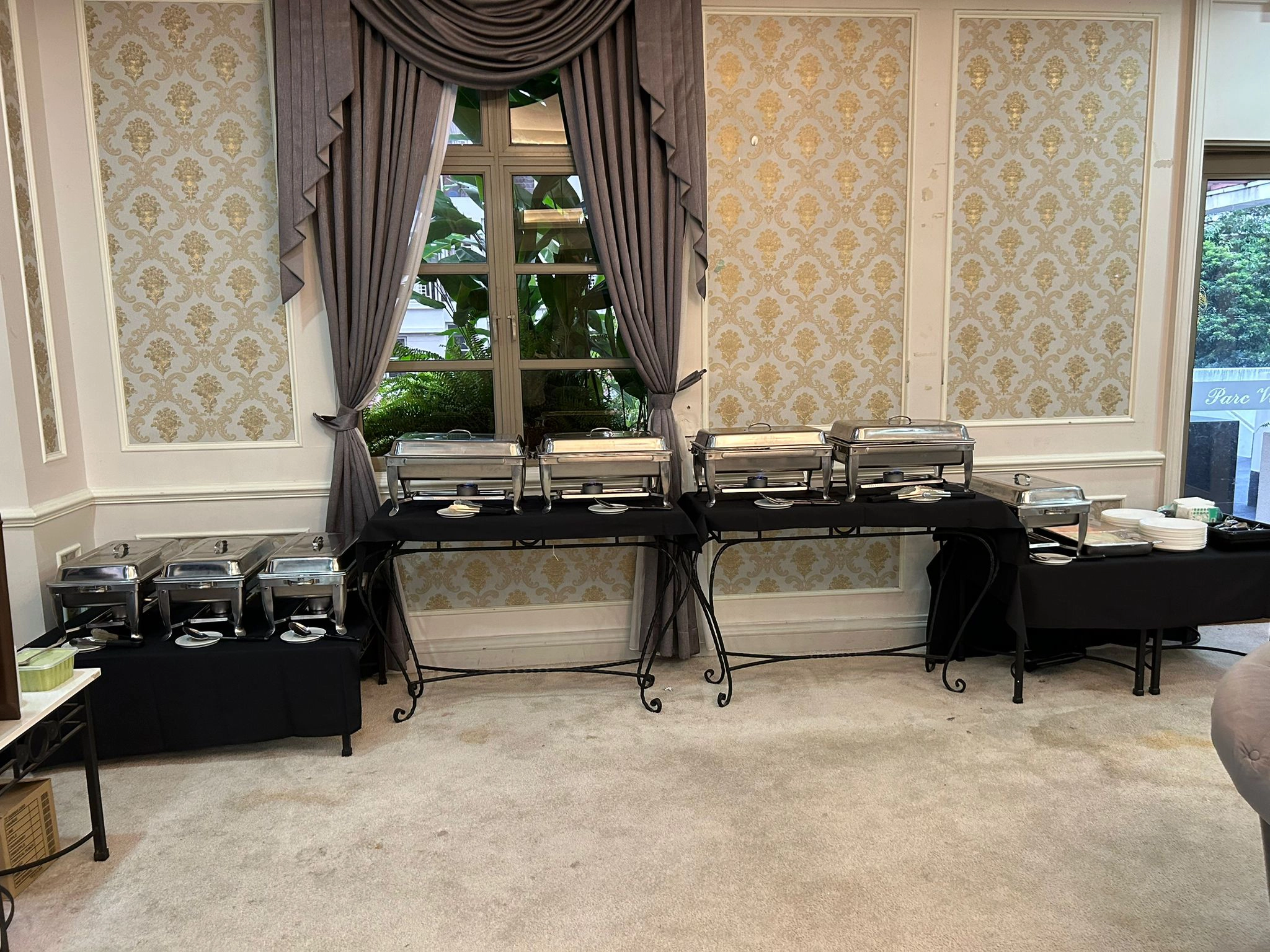 Professional buffet catering Singapore setup with stainless steel chafing dishes for events