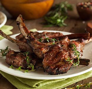 Juicy grilled lamb chops with garlic and fresh herbs served at best mexican restaurant in boat quay