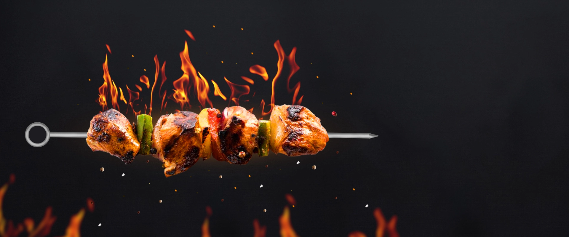 Grilled chicken skewer with red onion and bell pepper cooked over open flames at best Mexican restaurant in Boat Quay