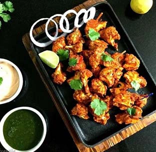 Smoky and flavourful tandoori gobi tikka served fresh and hot at best indian food in singapore