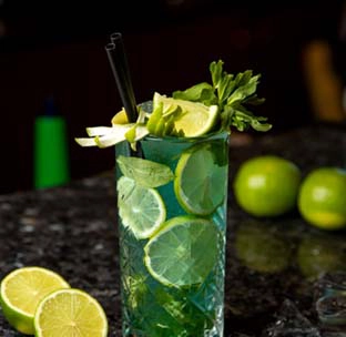 Vibrant blue mojito tropical cocktail with rum served at best indian food in singapore